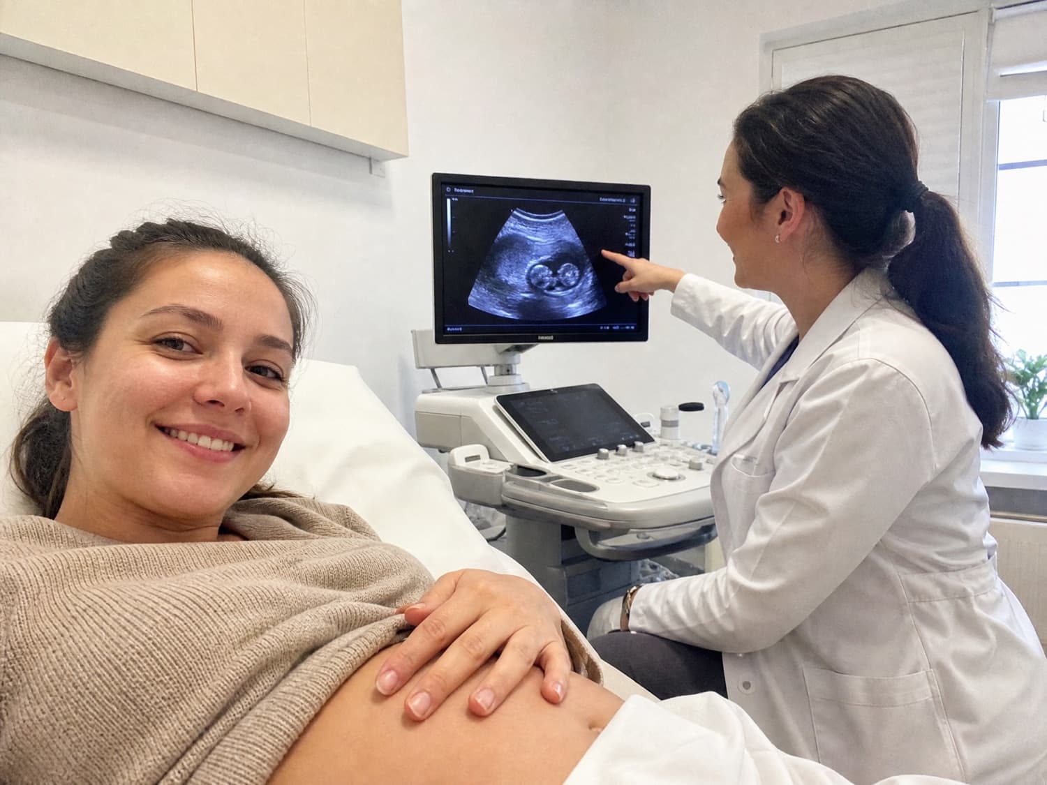 A surrogate mother at an ultrasound appointment with her doctor