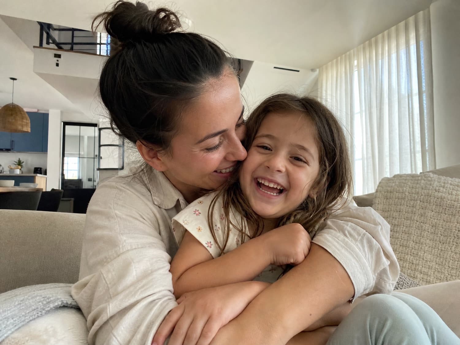 A surrogate mother playing with her own child at home